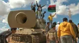 Libyjští povstalci v Benghází
