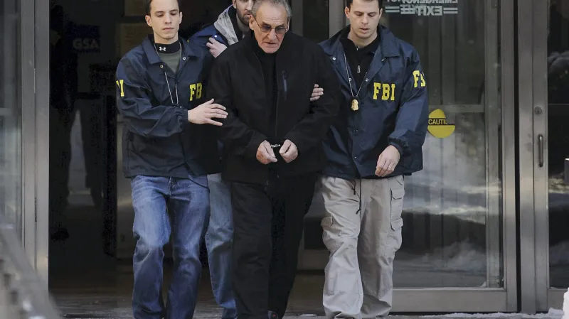 Asaro krátce po zatčení v roce 2014