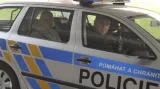 Roman Boček v policejním autě