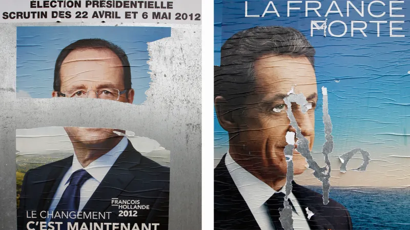 Poškozené plakáty Hollanda a Sarkozyho