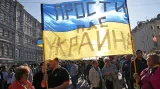Odpusť nám, Ukrajino, hlásí transparent v Moskvě