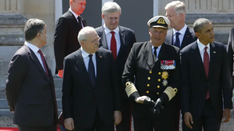 Putin čelí v Normandii vlažnému přijetí