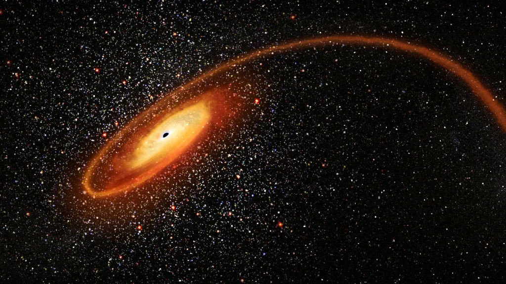 NASA zachytila „Kosmická vraždu“. Na snímku je hvězda drcena intenzivním gravitačním tahem černé díry, která je obklopena sluneční září tisíce okolních hvězd. Snímek byl dodatečně upravován
