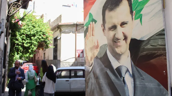 Billboard s prezidentem Bašárem Asadem v Damašku