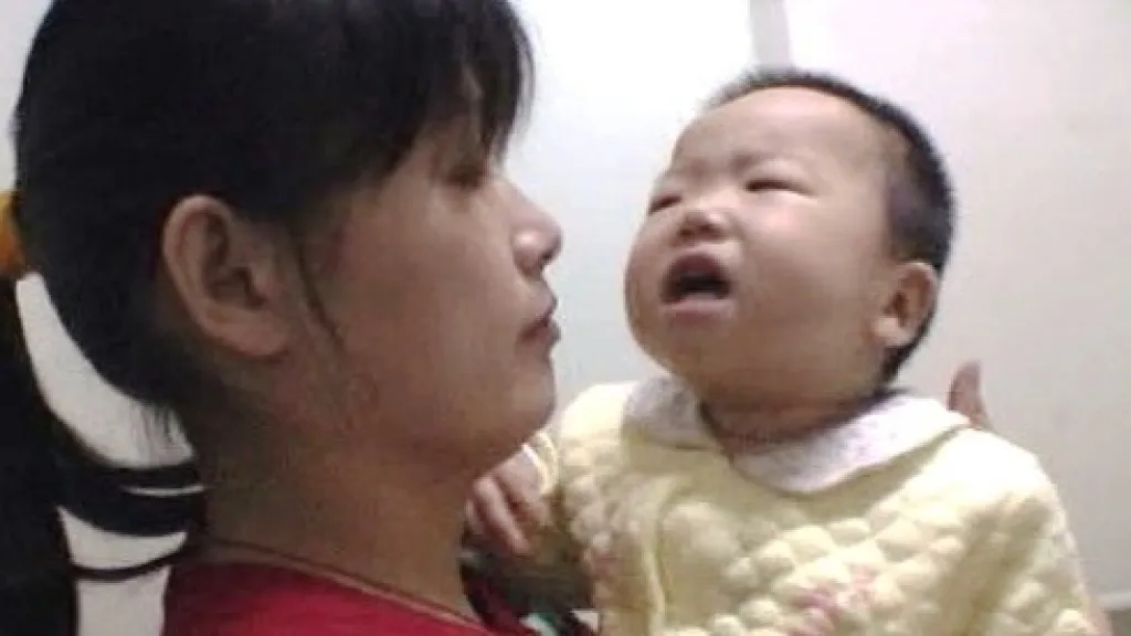 Čínská matka s nemocným dítětem