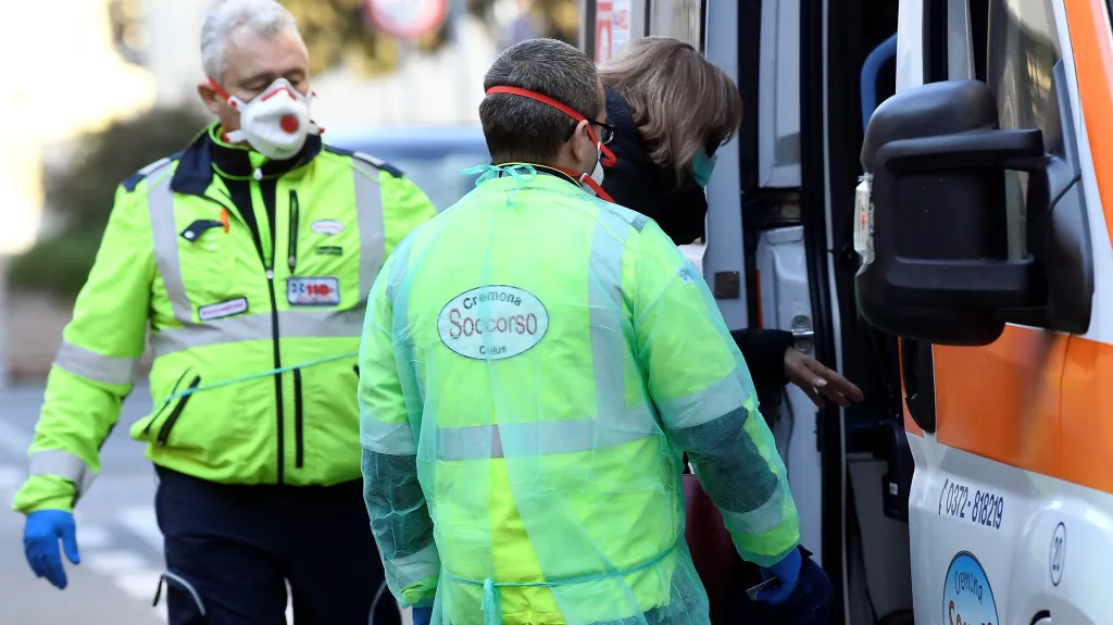 A woman is taken into an ambulance amid a coronavirus outbreak in northern Italy, in Casalpusterlengo, February 22, 2020. REUTERS/Flavio Lo Scalzo
