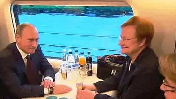 Ruský premiér Vladimir Putin a finská prezidentka Tarja Halonenová