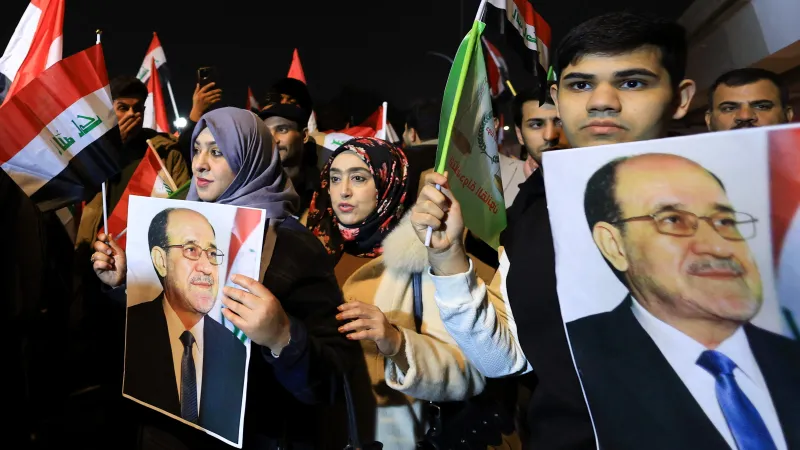 Stoupenci expremiéra Málikího během protestů proti Trumpovi