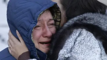 Pozůstalí obětí požáru v Permu