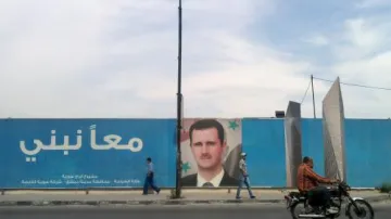 Plakát prezidenta Asada v Damašku