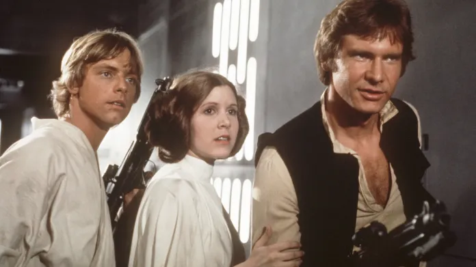 Mark Hamill jako Luke Skywalker, Carrie Fisherová jako princezna Leia a Harrison Ford jako Han Solo
